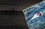 Jeans Lack And And Credit Card On The Wooden Floor Stock Photo