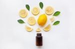 Empty Medicine Bottle With Fresh Lemon Slices And Leaf Stock Photo