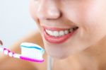 Beautiful Young Woman Picking His Teeth Stock Photo