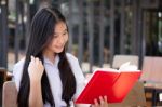 Asia Thai High School Student Uniform Beautiful Girl Read A Book Stock Photo