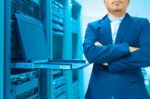 Man Fix Server Network In Data Center Room Stock Photo