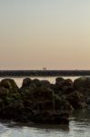 Tide Breaker Pier At Sunset Stock Photo