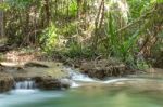 The Water Flowing Over Rocks And Trees Down A Waterfall At Huay Mae Khamin Waterfall National Park ,kanchana Buri In Thailand Stock Photo