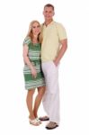 Full Length Of Smiling Middle Aged Couple Standing And Looking At You Stock Photo