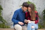 Young Couple Using Smart Phone Stock Photo