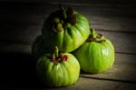 Still Life With Fresh Garcinia Cambogia On Wooden Background Stock Photo