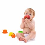 Cute Infant Boy With Apple Stock Photo