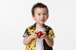 Happy Boy With A Red Apple Stock Photo