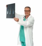 Smiling Male Doctor Holding X Ray Stock Photo