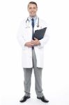 Full Length Portrait Of Doctor At Duty Stock Photo