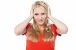 Young Woman Covering Her Ears Stock Photo