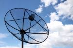 Satellite Dish And Clouds On Blue Sky Stock Photo