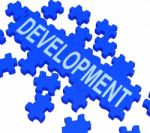 Development Puzzle Shows Business Improvement Stock Photo