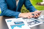 Handsome Businessman Wearing Suit And Using Modern Laptop Outdoo Stock Photo