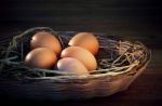 Fresh Eggs On Rice Straw Basket Stock Photo