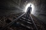 Man In A Tunnel Looking Towards The Light Stock Photo