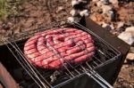 Travel Kielbasa Cooking. Uncooked Sausages Stock Photo