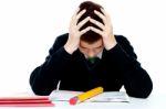 Confused School Boy With Notebook Stock Photo