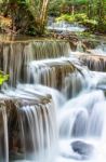 The Water Flowing Over Rocks And Trees Down A Waterfall At Huay Mae Khamin Waterfall National Park ,kanchana Buri In Thailand Stock Photo