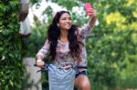 Pretty Young Girl Riding Bike And Taking A Selfie Stock Photo