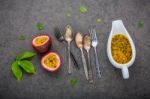 Fresh Passion Fruits Set Up On Dark Stone Background. Passion Fr Stock Photo