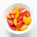 Cherry Tomatoes In White Bowl Stock Photo