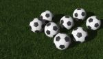 Soccer Balls On Green field  Stock Photo