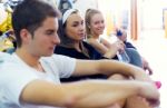 Young People Resting After Class In The Gym Stock Photo