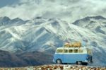 Traveling Car Parking On Road Side Against Beautiful Snow Mountain Background Stock Photo