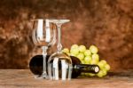 Glasses With Wine Bottle And Grapes Stock Photo