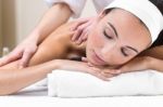 Woman Enjoying Shoulder Massage At Beauty Spa Stock Photo