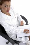 Sitting Doctor With Writing Board Stock Photo