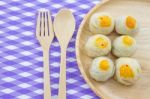 Chinese Pastry Mung Bean Or Mooncake With Egg Yolk On Wooden Dish And Spoon Fork Striped Cloth.chinese Pastry Mung Bean Or Mooncake With Egg Yolk On Wooden Dish And Spoon Fork Striped Cloth Stock Photo