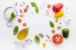 The Ingredients For Homemade Pizza On White Wooden Background Stock Photo