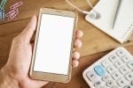 Hand Of Young Man Holding Smart Phone Mobile Stock Photo