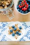 Healthy Breakfast With Granola, Yogurt And Fresh Fruits Stock Photo