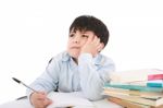 Upset School Boy Doing Homework Stock Photo