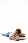 Front View Of Boy Sleeping On Books Stock Photo