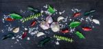 Top View Of Food Ingredients And Condiment On The Table, Ingredients And Seasoning On Dark Wooden Floor Stock Photo