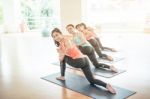 Asian Woman Doing Yoga Indoors Stock Photo