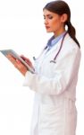 Young Female Doctor Using Digital Tablet Stock Photo