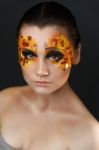 Orange And Red Rhinestones On A Girl Face Stock Photo