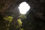 Sunlight Through A Cave Hole In Thailand Stock Photo