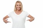 Smiling Woman Pointing Her Stomach Stock Photo