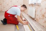 Man Laying Laminate Flooring Stock Photo