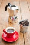 Red Cup Of Espresso On Wooden Table Stock Photo