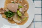 Rad Na, Famous Thai Chinese Style Wide Rice Noodle Dish With Tasty Tender Pork With Thick Gravy Sauce. Close Up Stock Photo