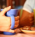 Friends Having Coffee And Cookies Stock Photo