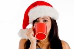 Girl Drinking Coffee Wearing Christmas Hat Stock Photo