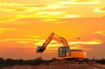 Excavator At Construction Site Stock Photo